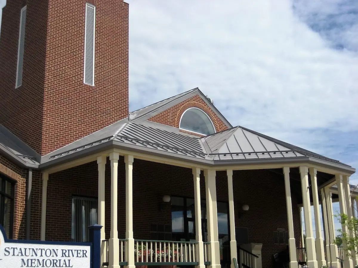 Skilled roofing craftsmen working on a residential roof in Gotts